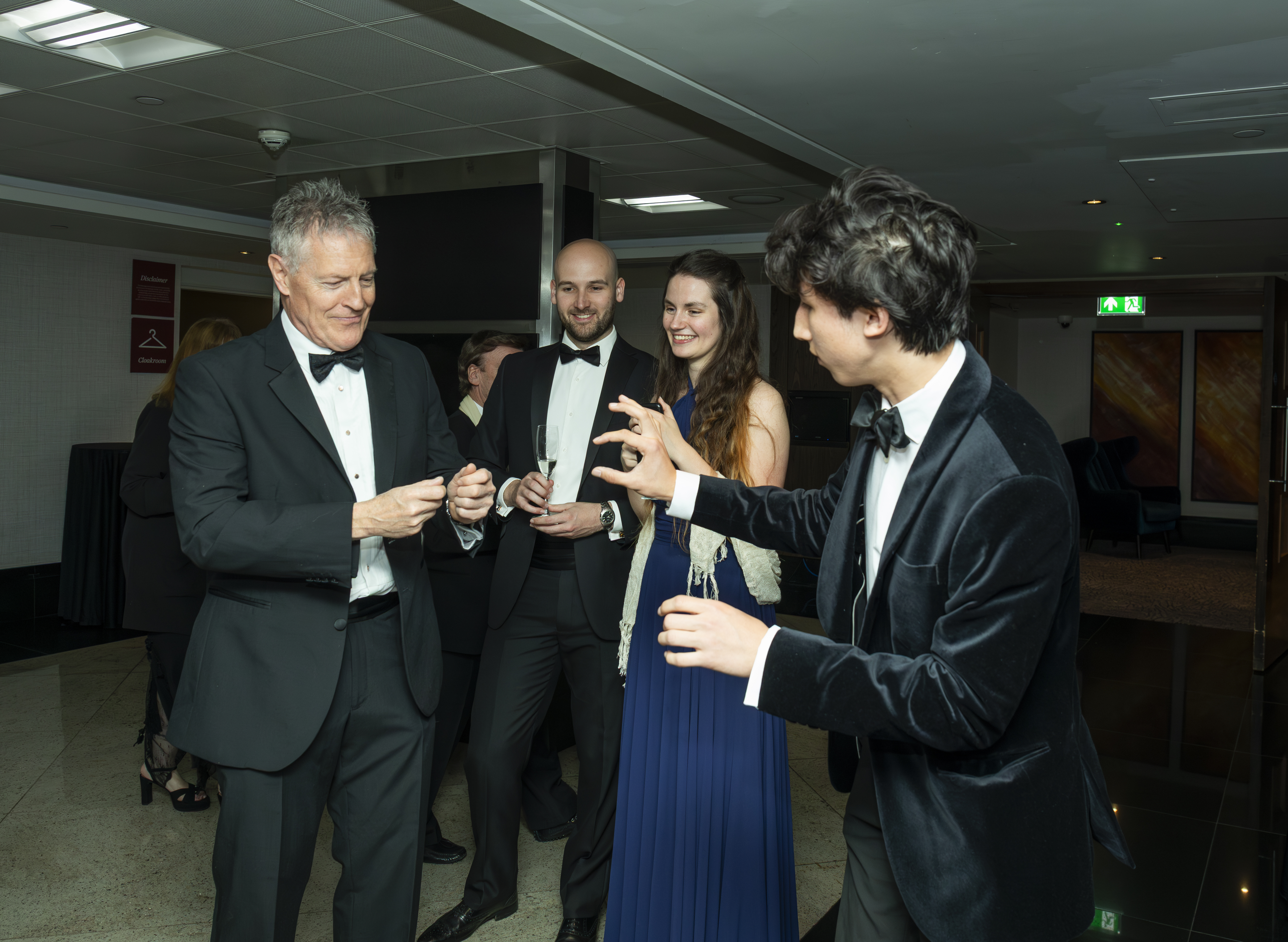 Noah performing for guests at an event